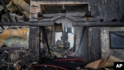 Firefighters work at the scene after a fire broke out at a hotel in the ski resort of Kartalkaya, located in Bolu province, northwest Turkey, Jan. 21, 2025.