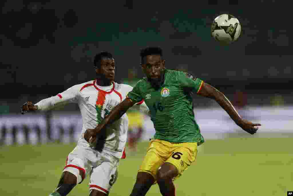 Burkina Faso's Dango Aboubacar Ouattara, left, vies for the ball with Ethiopia's, right, Yared Bayeh, during the soccer match between Burkina Faso and Ethiopia; Cameroon, Jan. 17, 2022. 