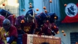 Revelers take part in a fight with oranges during an annual carnival battle in Ivrea, Italy, March 2, 2025. 