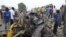 People look at damage in a market area after a bomb explosion in Ajilari-Gomari near the city's airport, Maiduguri, Borno State March 2, 2014.