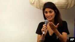 FILE - Rome's Mayor Virginia Raggi is seen during a press conference at Rome's Capitol Hill, Aug. 31, 2017.