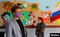 Municipal candidate and Alexei Navalny ally in Tomsk. Andrei Fateev, is seen at the polling station in Tomsk, Russia, Sept. 12, 2020.