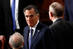 FILE - Sen. Mitt Romney, R-Utah, arrives before President Donald Trump delivers his State of the Union address to a joint session of Congress on Capitol Hill in Washington, Feb. 4, 2020.