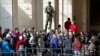 Tourists line up at the Capitol Visitors Center in Washington DC, March 7, 2013. 