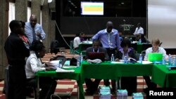 FILE - Election clerks go through the re-tallying of votes after the Kenya Supreme Court issued an order in the ongoing presidential poll petition in Kenya's capital Nairobi, March 26, 2013.