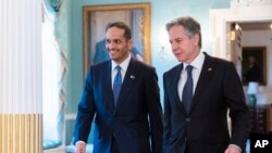 FILE - Secretary of State Antony Blinken, right, and Qatar's Prime Minister and Foreign Affairs Minister Mohammed Bin Abdulrahman Al Thani, walk to the Treaty Room at the State Department, Monday, Jan. 29, 2024, in Washington.