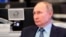 Russian President Vladimir Putin visits the Coordination Center of the Russian Government in Moscow, Russia, April 13, 2021. 