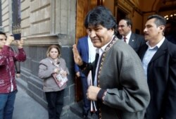 FILE - Bolivia's former President Evo Morales gestures after a news conference, in Mexico City, Mexico, Nov. 27, 2019.