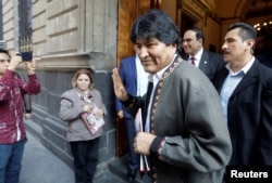 FILE - Bolivia's former President Evo Morales gestures after a news conference, in Mexico City, Mexico, Nov. 27, 2019.