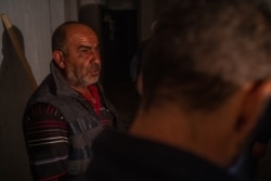 A man identifying himself as Lord Milord takes shelter underground after bombing in Nagorno-Karabakh, Oct. 9, 2020. (Yan Boechat/VOA)