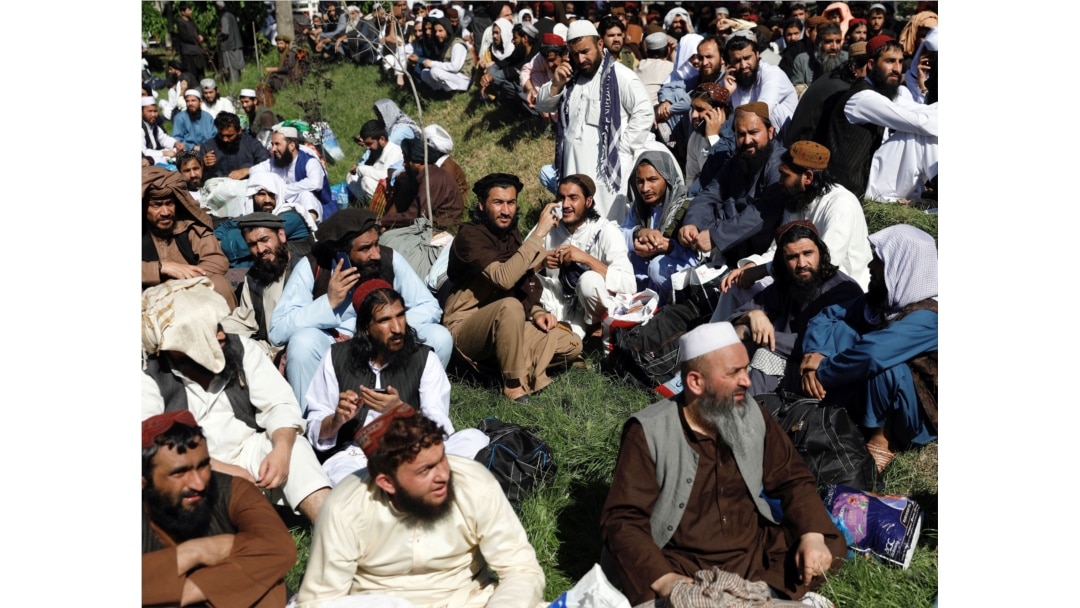 FILE - Newly freed Taliban prisoners are seen gathered at Pul-i-Charkhi prison, in Kabul, Afghanistan, May 26, 2020.