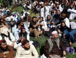 FILE - Newly freed Taliban prisoners are seen gathered at Pul-i-Charkhi prison, in Kabul, Afghanistan, May 26, 2020.
