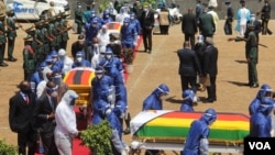 Coffins of Minister of Foreign Affairs Sibusiso Moyo, Transport Minister Joel Biggie Matiza and former head of prisons Paradzai Zimond, in Harare, Jan. 27, 2021. (Columbus Mavhunga/VOA)