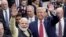FILE - Indian Prime Minister Narendra Modi and U.S. President Donald Trump walk the perimeter of the arena floor to greet attendants after Modi's speech during the "Howdi Modi" event on Sept. 22, 2019, at NRG Stadium in Houston, Texas.