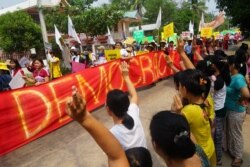 People take part in a demonstration against the military coup in Win Yay township, in eastern Myanmar's Karen state, in this handout photo from the Karen Information Center taken on April 1, 2021, and released to AFP on April 2, 2021.