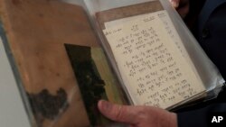 Israel's ambassador in Germany, Jeremy Issacharoff, holds documents prior to a handing over ceremony at the embassy of Israel in Berlin, Germany, May 21, 2019. 