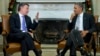 President Barack Obama meets with Colombian President Juan Manuel Santos in the Oval Office of the White House in Washington, Dec. 3, 2013