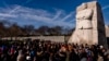 FILE - People attend a wreath-laying ceremony at the Martin Luther King Jr. Memorial marking MLK Day in Washington, Jan. 16, 2023.