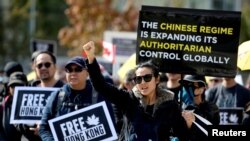 FILE - Supporters hold a rally in solidarity with Hong Kong protesters, in Vancouver, British Columbia, Sept. 29, 2019. 
