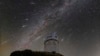 This Dec. 14, 2023 image made available by NOIRLab shows meteors from the Geminid meteor shower streaking across the sky above the Nicholas U. Mayall Telescope at Kitt Peak National Observatory (KPNO), a Program of NSF's NOIRLab, in Tucson, Ariz. 