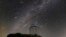 This Dec. 14, 2023 image made available by NOIRLab shows meteors from the Geminid meteor shower streaking across the sky above the Nicholas U. Mayall Telescope at Kitt Peak National Observatory (KPNO), a Program of NSF's NOIRLab, in Tucson, Ariz. 