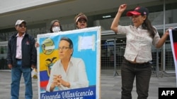 Supporters of Fernando Villavicencio shout slogans as they await the sentencing of five people in the assassination of the Ecuadorian presidential candidate, at the Judicial Complex in Quito, July 12, 2024.