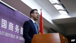 FILE - Chinese Ministry of Commerce spokesman Gao Feng speaks during a press conference at the Ministry of Commerce in Beijing, China, April 6, 2018. 