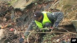 A volunteer removes trash from Boiling Brook in Maryland.