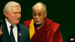 Nobel Peace Prize winner and former Polish President Lech Walesa, left, and fellow laureates the Dalai Lama, center, and Adolfo Perez Esquivel, right, greet each other in Gdansk, Poland, Friday, Dec. 5, 2008. Walesa is hosting a handful of Nobel Peace Prize laureates to mark the 25th anniversary of his Nobel Peace Prize win. (AP Photo/Czarek Sokolowski)