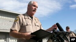 Phil Johnston, the assistant sheriff for Tehama County, briefs reporters on the shootings near the Rancho Tehama Elementary School, Tuesday, Nov. 14, 2017, in Corning, Calif.