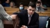 Kyle Rittenhouse pulls numbers of jurors out of a tumbler during his trial at the Kenosha County Courthouse in Kenosha, Wisconsin, Nov. 16, 2021.