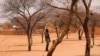 Burkina Faso military soldier stands guard in Sahel