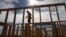 Construction worker Elabert Salazar works on a house frame for a new home in Chula Vista, Calif., Nov. 16, 2012.