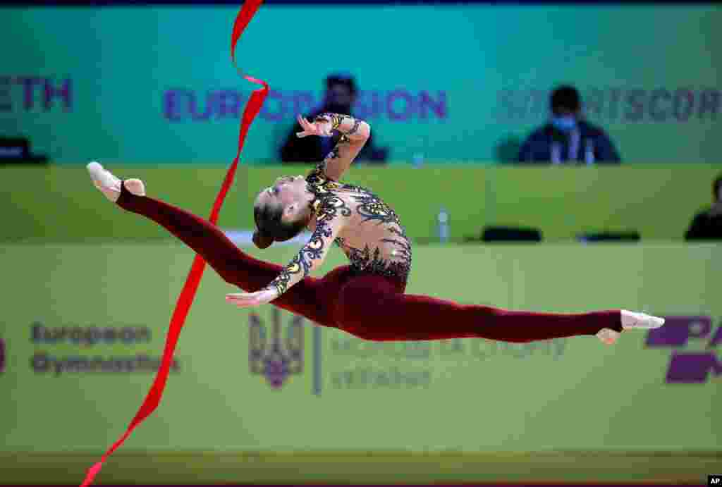 Vlada Nikolchenko of Ukraine performs with the ribbon during the 36th European Rhythmic Gymnastics Championships in Kyiv.