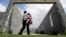 FILE - A woman who is in the country illegally plays with her 2-year-old daughter who was born in the in the United States but was denied a birth certificate, Sullivan City, Texas, Sept. 16, 2015.