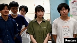 Yuna Kato works with male students at her college club to produce a light human-powered aircraft at the school, at Tokyo University in Tokyo, Japan on June 30, 2023, in this screen grab from video. (REUTERS/Chris Gallagher)