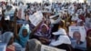 People attend a campaign rally for presidential candidate Boydiel Ould Houmeid in Nouakchott, Mauritania, June 18, 2014.