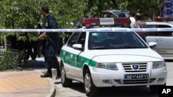 Police control the scene at the shine of late Iranian revolutionary founder Ayatollah Khomeini, just outside Tehran, Iran, June 7, 2017.