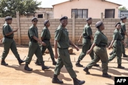 FILE—A group of Gauteng Crime Prevention Wardens, better known as “AmaPanyaza,” patrol in the streets of Eden Park, Alberton, on April 12, 2024.