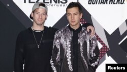 FILE - Twenty one pilots pose on the red carpet during the MTV EMA awards at the Assago forum in Milan, Italy.