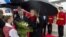 US Secretary of State Hillary Clinton receives flowers upon arrival at Tirana Rinas Airport in Tirana, Thursday, Nov. 1, 2012. Hillary Clinton arrived in EU-hopeful Albania on the last leg of her Balkans tour where she is expected to urge opposing politic
