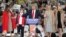 Republican presidential candidate Donald Trump , center, speaks with, from left, his wife, Melania, left, son Baron, and daughters Ivanka and Tiffany during a campaign rally in Myrtle Beach, South Carolina, Nov. 24, 2015.