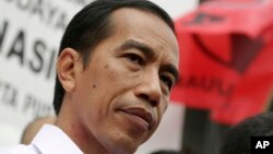 Kandidat presiden Indonesia Joko Widodo dalam sebuah kampanye Partai Demokrasi Indonesia Perjuangan di Jakarta (16/3). (AP/Achmad Ibrahim)