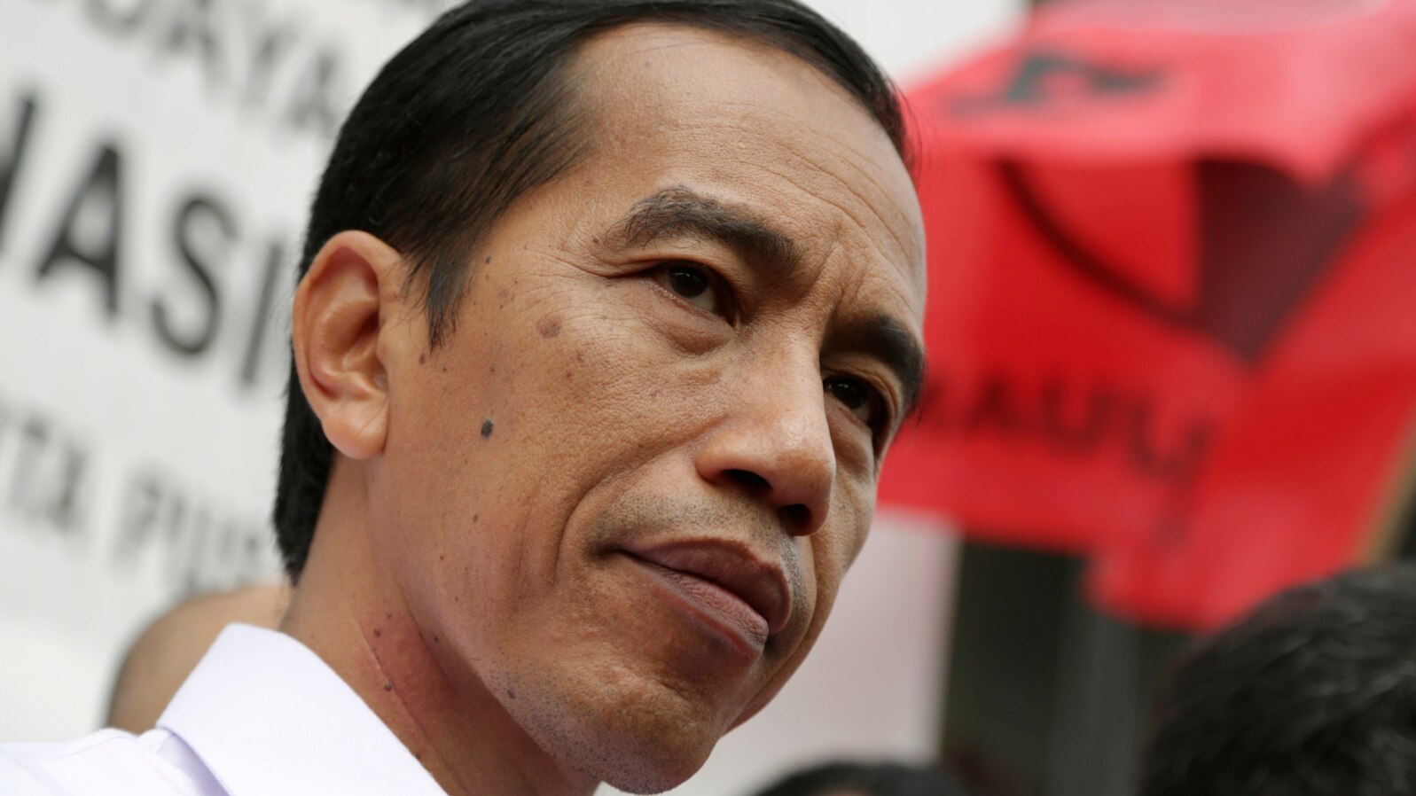Indonesian presidential candidate Joko Widodo talks with his supporters during a campaign event by the Indonesian Democratic Party of Struggle (PDIP) in Jakarta, Indonesia, March 16, 2014.
