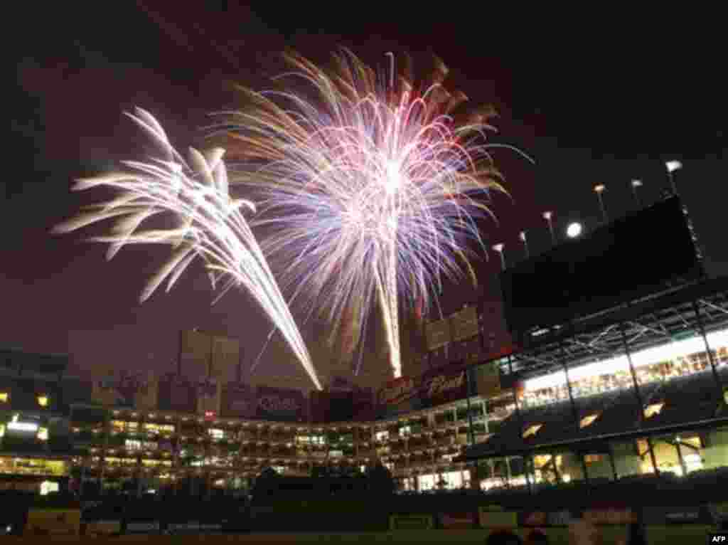 Fireworks illuminate the sky for the Fourth of July celebration following the baseball game between the Baltimore Orioles and the Texas Rangers, Monday, July 4, 2011, in Arlington, Texas. The Rangers won 13-4. (AP Photo/Jim Cowsert)