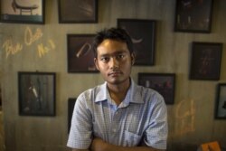 FILE - Activist and poet Maung Saungkha poses in Yangon, March 28, 2017.