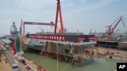 Upacara peluncuran Fujian, kapal induk ketiga China di Shanghai, Jumat, 17 Juni 2022. (Li Gang/Xinhua via AP)