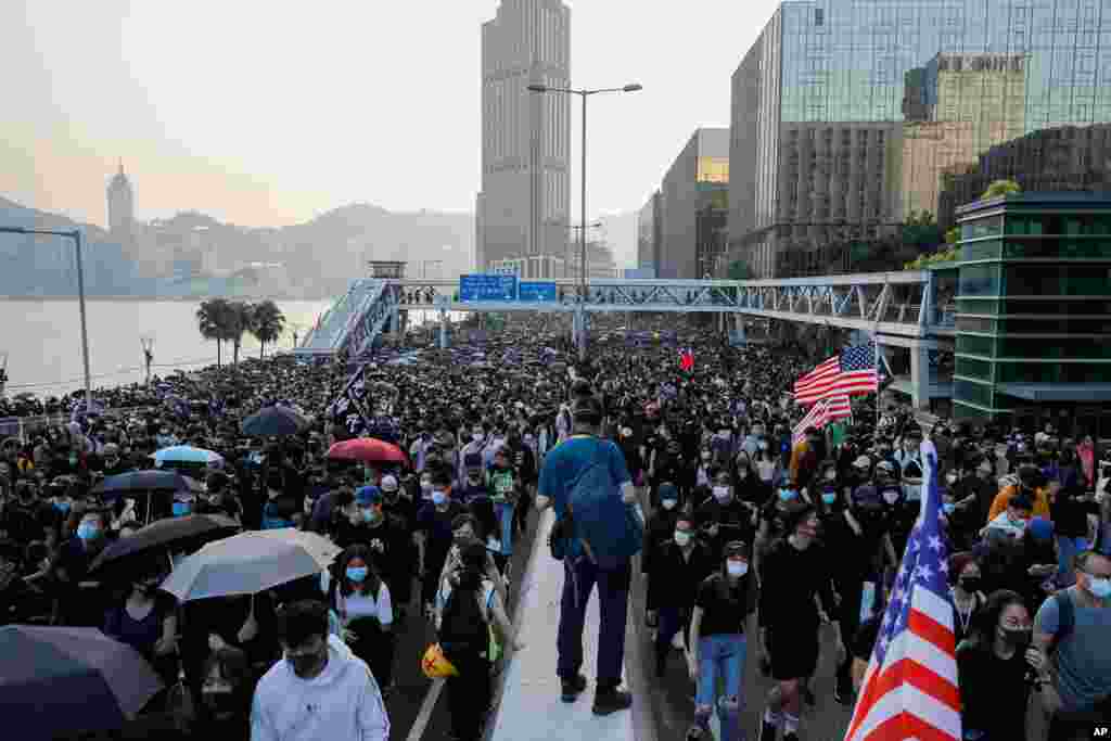Pro-democracy protesters march on a street during a rally in Hong Kong.