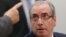 FILE - Brazil's suspended lower house speaker, Eduardo Cunha, listens to a questioner during an ethics committee hearing in parliament in Brasilia, May 19, 2016.