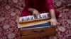 FILE - An Afghan musician plays the harmonium in Kabul, Afghanistan, on Sept. 16, 2021. Afghan musicians and singers in Pakistan received a temporary reprieve on Jan. 10, 2025, from a court that ruled they could not immediately be deported back to Afghanistan.